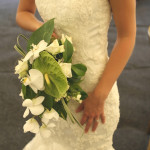 Traditional white dress with a bouquet of flowers