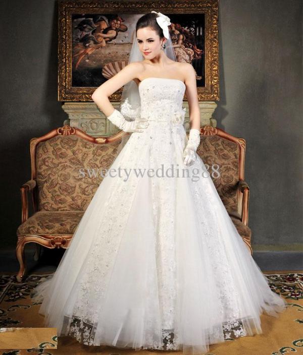 wedding gown with gloves and veil